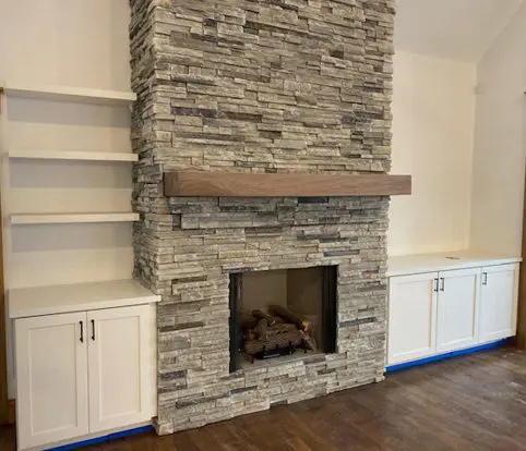 Rice Furniture & Design Center | custom wood mantle and cabinets surrounding brick fireplace Rice Furniture & Design Center | custom wood mantle and cabinets surrounding brick fireplace