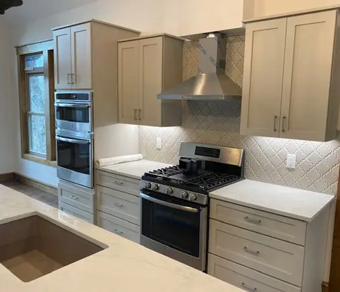Rice Furniture & Design Center | wood cabinets custom designed for a kitchen with a tiled backsplash and under cabinet lighting Rice Furniture & Design Center | wood cabinets custom designed for a kitchen with a tiled backsplash and under cabinet lighting